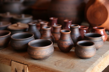 clay pots on a shelf in a store