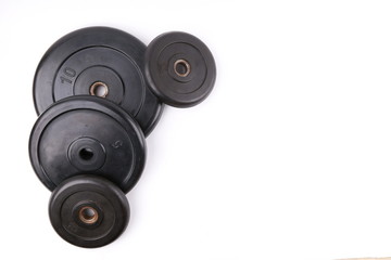 barbell weights on white background with copy space