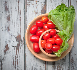 fresh tomatoes  on wooden table