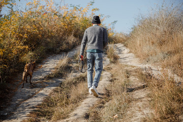 Man walking with his dog stock photo