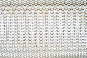 Close-up metal mesh structure with equal intervals of holes