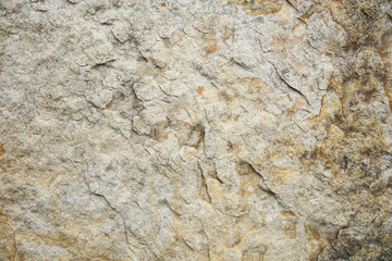 rough natural stone background close up 