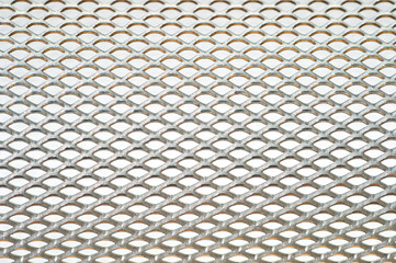 Close-up metal mesh structure with equal intervals of holes