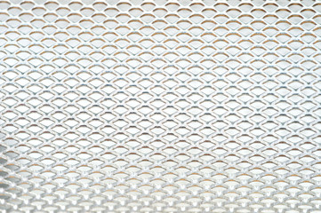 Close-up metal mesh structure with equal intervals of holes