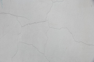 old gray concrete wall  with cracks background