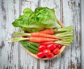 Organic vegetables  isolated on wooden background