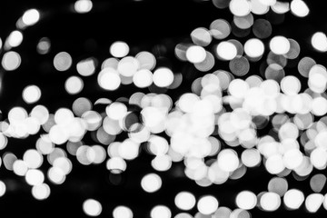 Out of focussed bokeh of christmas lights with black background 