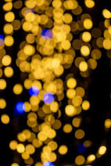 Out of focussed bokeh of christmas lights with black background 