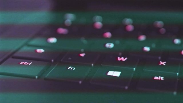  VHS vintage film effect over ultralight PC laptop from Razer testing the Razer Chroma single-zone RGB illuminated lighting of the keyboard 