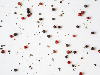 Creative decorative food composition of various spices on white background.