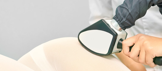 Vaccuum massage procedure. Anti cellulite lpg treatment. Cosmetology slimming. Medical device. Woman and doctor in salon. Lipo contouring
