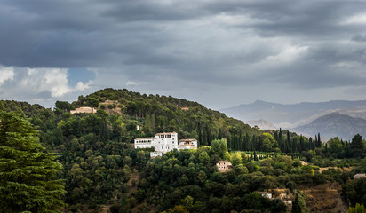 Fototapeta na wymiar View of the Generalife Palace (north side). Taken from the Albaicín hill district, Granada, Andalusia, Spain. 