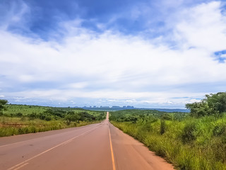 View of a asphalt road with mountains Pungo Andongo, Pedras Negras (black stones)