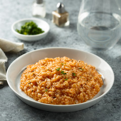 Homemade tomato risotto with herbs