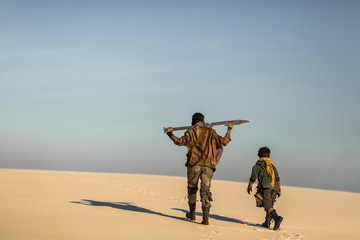 Post Apocalyptic Woman and Boy Outdoors in the Wasteland