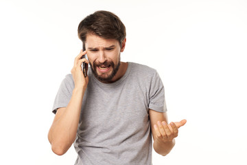 young man talking on the phone isolated on white