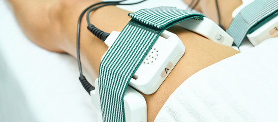 Laser lipo equipment. Cosmetic fat reduce treatment. Woman in medicine salon. Anti cellulite procedure