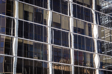 Obraz premium Reflections in glass building on Macquarie Street in the western suburb of Parramatta, Sydney, Australia