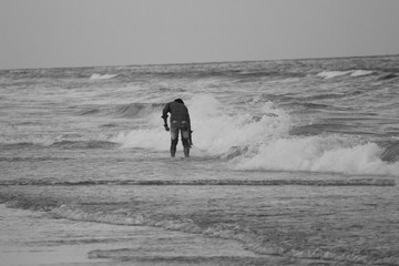 Chennai, Tamilnadu / India - November 25 2019: black&white photo of man enjoying in Chennai marina beach with lot of enjoyment in the the weekend