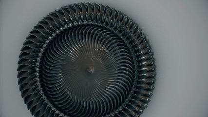 Spirale aus Metall vor grauem Hintergrund