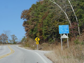 Roadside warning signs along Interstate 49 in Arkansas.
