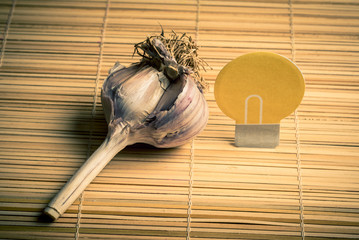 Garlic head on a wooden Mat. Space for lettering or design