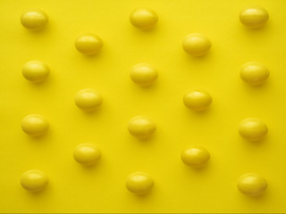 Pattern Of Chicken Eggs In Line Against Yellow Background