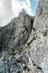 Via ferrata climbing path landscape in Vršič pass in Slovenia, in between Mojstrovka and Prisojnik mountain, nerby famous Hanzova pot rock window in beautiful weather