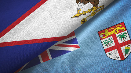 Fototapeta premium American Samoa and Fiji two flags textile cloth, fabric texture
