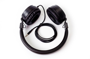 Wired headphones, black, with soft inserts, great sound, shot on a white background
