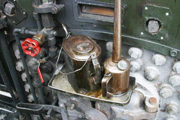 Steam locomotive details on a rainy, snowy day