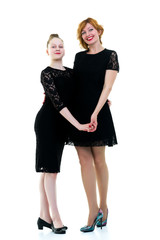 Mom and daughter hold hands.