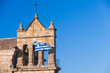 Greek flag on belfry of Saint Nicholas Molou