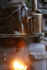 Steam locomotive details on a rainy, snowy day
