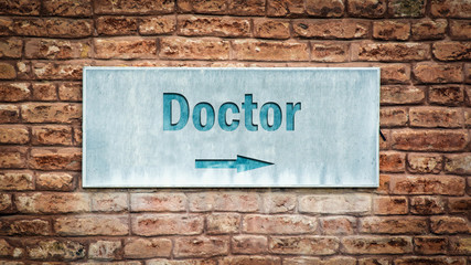 Fototapeta na wymiar Street Sign to Doctor
