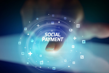 Finger touching tablet with social media icons and SOCIAL PAYMENT