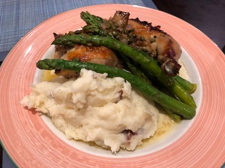 Complete meal of mashed potatoes, asparagus and baked chicken