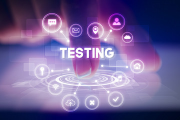 Finger touching tablet with web technology icons and TESTING inscription, web technology concept