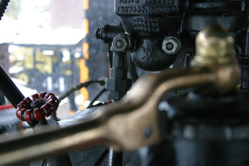 Steam locomotive details on a rainy, snowy day
