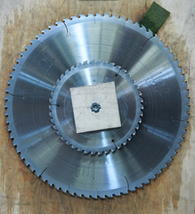 A giant large stainless steel saw blade disc, laser cut for premium sharpness. Wood cutting and tree cutting industrial equipment. circular saw disc blade ready to be used in joinery.