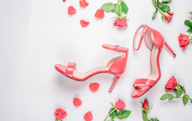 coral sandals on white background Flat lay, top view trendy fashion feminine background. Beauty blog concept.