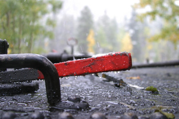 Detail of steam locomotive on a rainy and snowy day