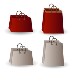 Set of four party favor gift white and red paper with gold ribbon bags isolated on white background.