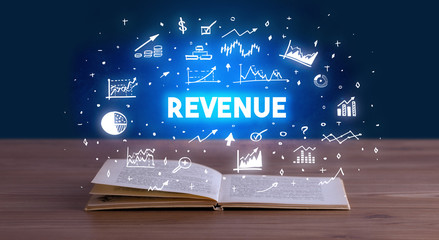 REVENUE inscription coming out from an open book, business concept