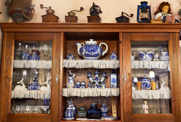 Old wooden vintage cupboard with utensils
