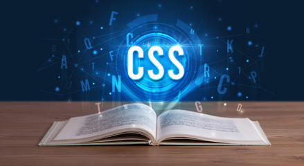 CSS inscription coming out from an open book, digital technology concept