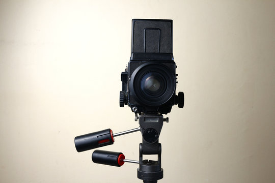 Old and vintage medium format film camera on a tripod