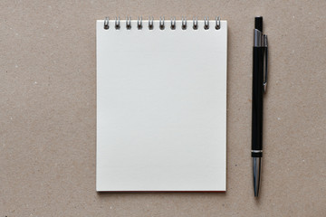 Empty notebook and pen - top view. High resolution photo.