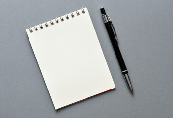 Empty notebook and pen - top view. High resolution photo.