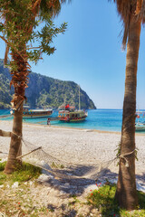 Summer butterfly valley sea beach view and cruise boat Oludeniz